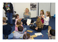 Dr. Becky Powell with young brats in 
                            Germany